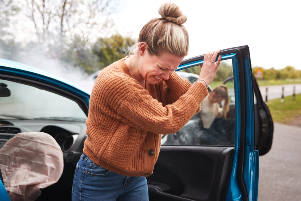 Woman with neck pain after a car accident injury