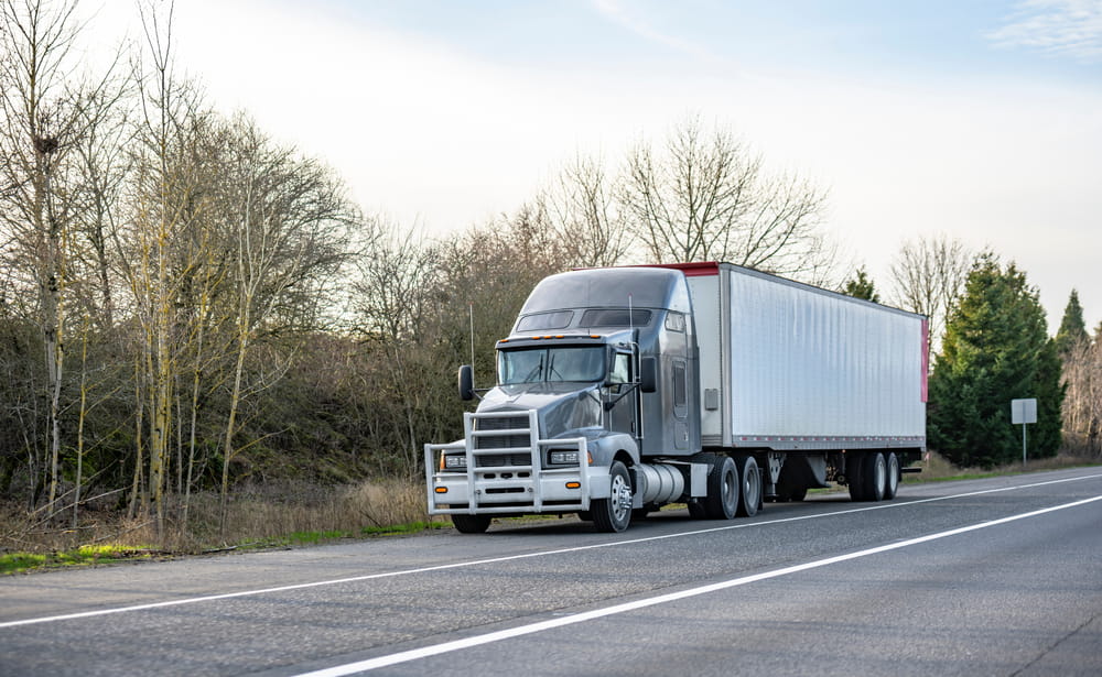 Commercial semi-truck traveling on a Florida roadway before a potential rear-end collision