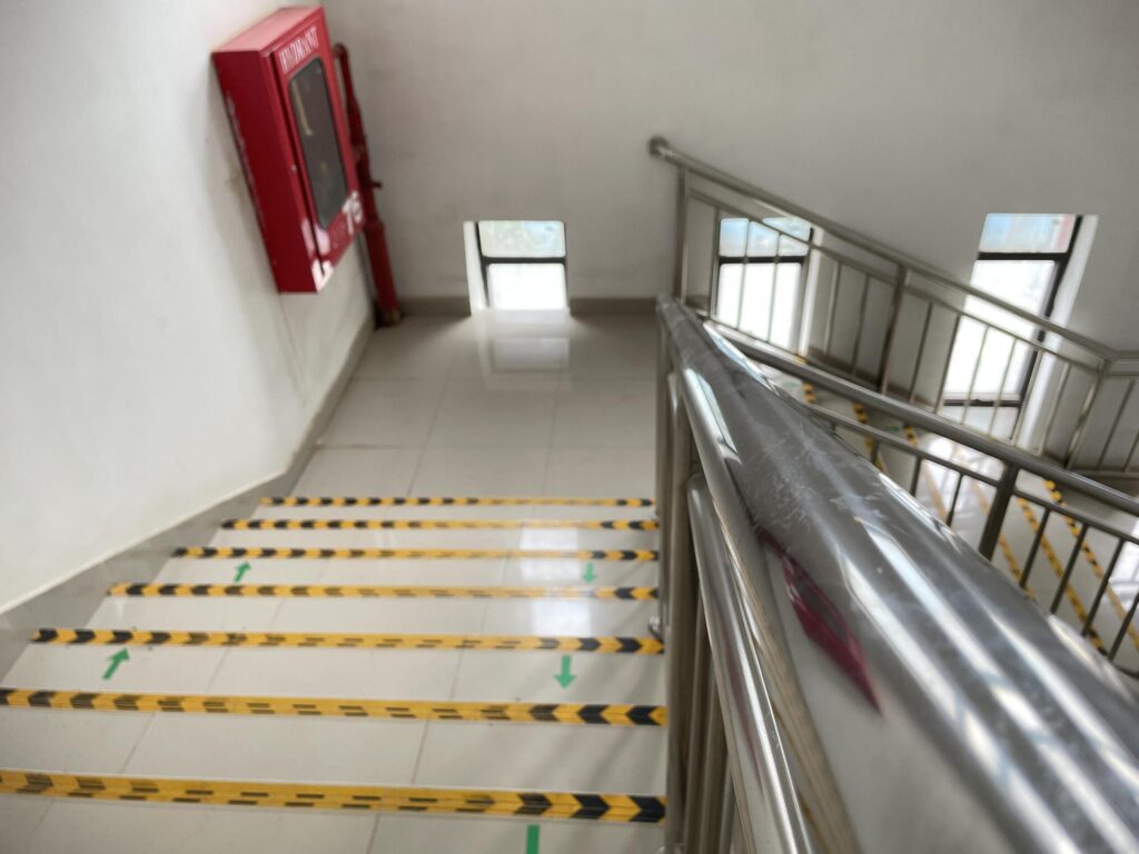 A staircase with safety striping representing hazards handled by Pembroke Pines Slip-and-Fall Accident Lawyers.